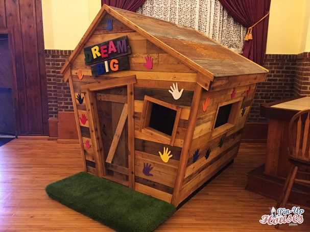 wooden playhouse with colorful decoration