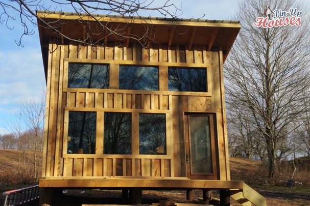 wood cabin with front porch