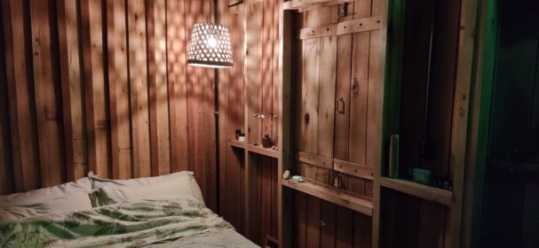 Rustic tiny house interior bedroom made from natural wood