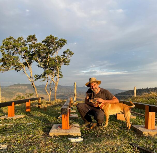 Off-grid tiny cabin foundation build with dog in rural mountain setting