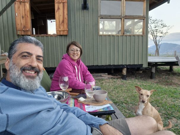 Life around an off-grid tiny wood cabin built from DIY cabin plans